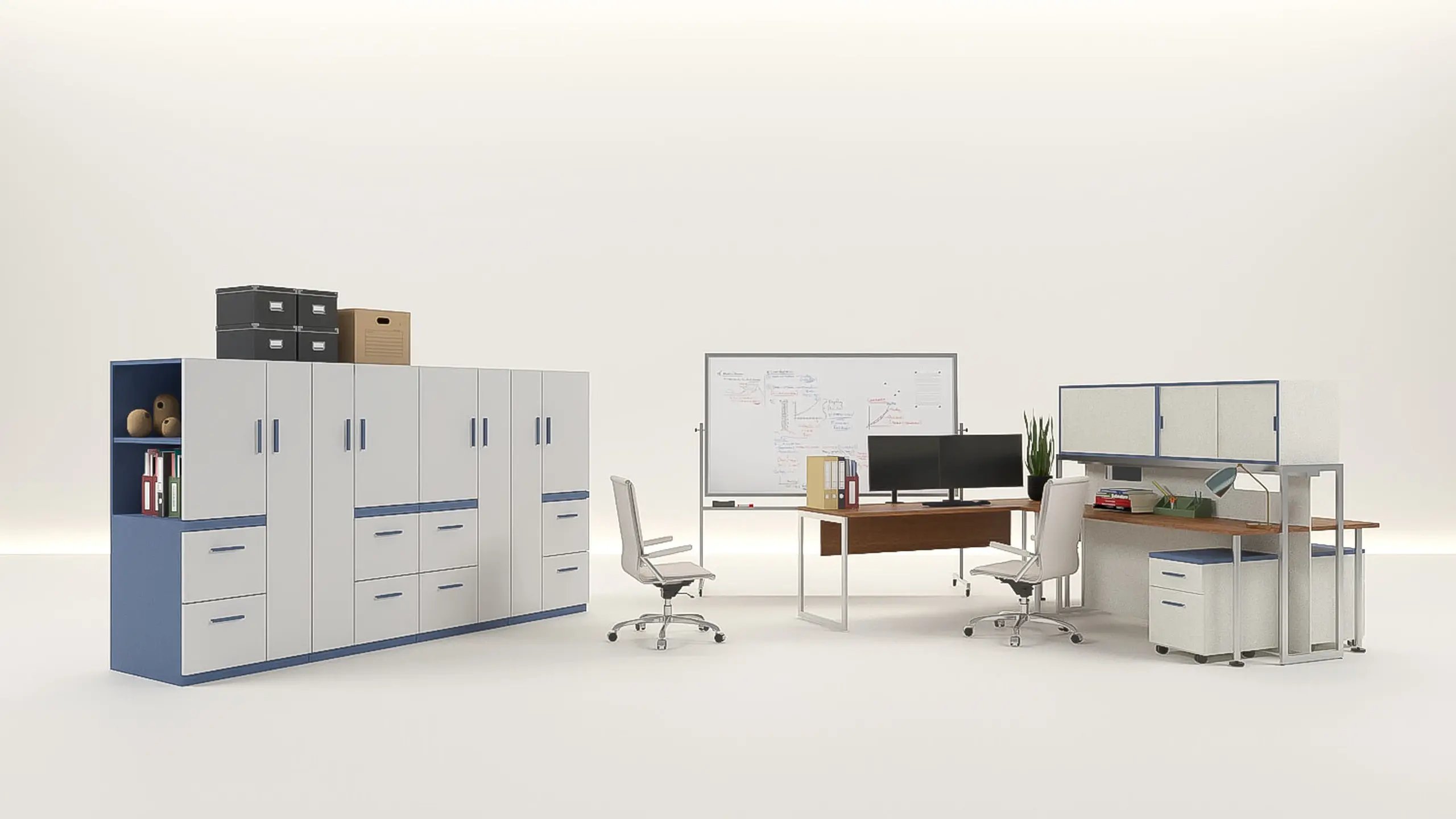 A run of storage cabinets topped with archive boxes, a mobile whiteboard covered in a workflow diagram, a desk with dual monitors, and a partitioned two-person workstation, on an open studio floor.