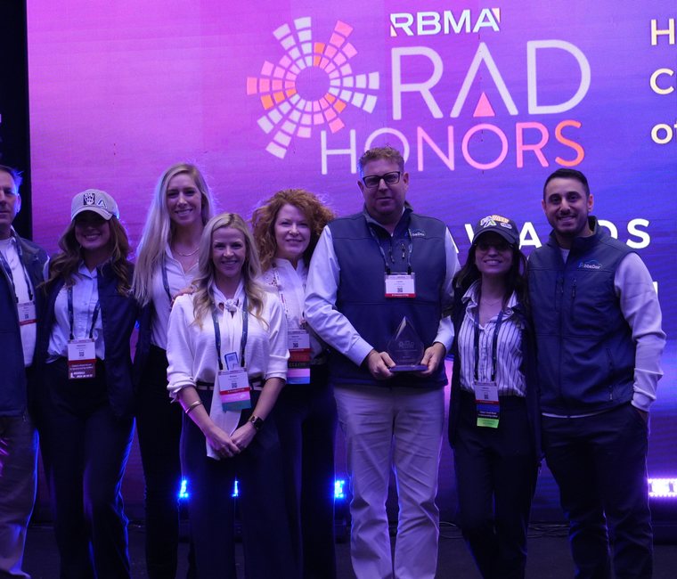 The AbbaDox team on the RBMA Rad Honors stage with the Culture and Well-Being Award at PaRADigm 2025 in Nashville
