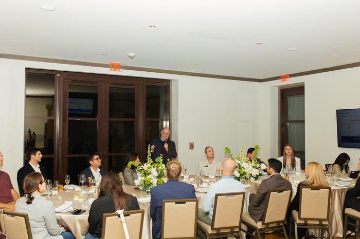 The Orlando room seated and listening as the conversation opens