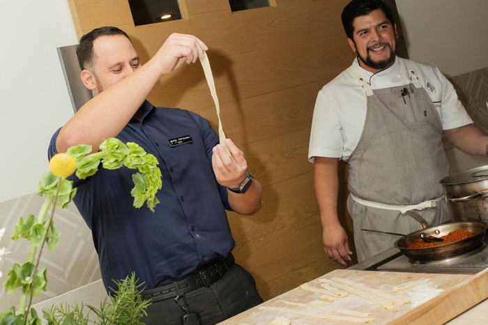 The kitchen team preparing the Orlando dinner in front of guests