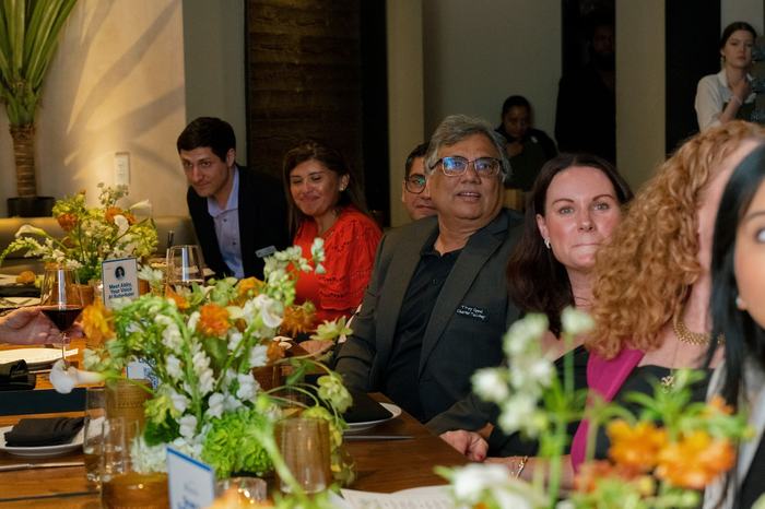 Guests along the Washington DC table mid dinner