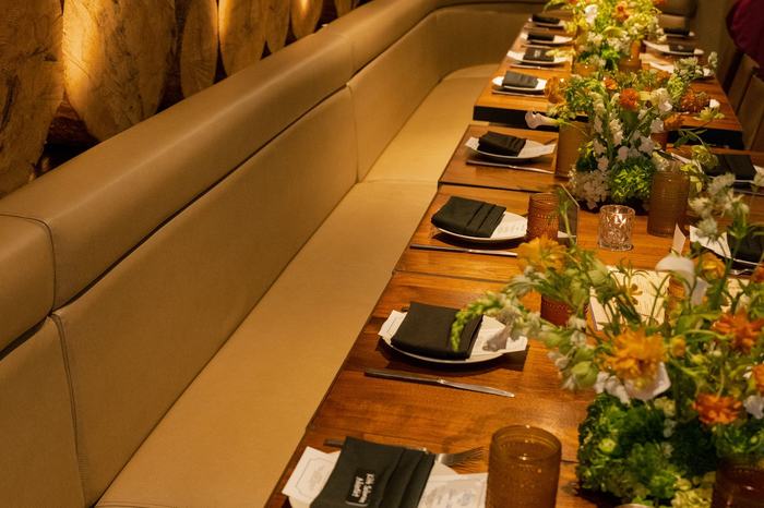 The Washington DC table laid down a long banquette with florals and low light