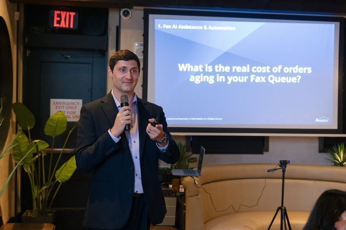 A discussion prompt on screen in Washington DC: what is the real cost of orders aging in your fax queue