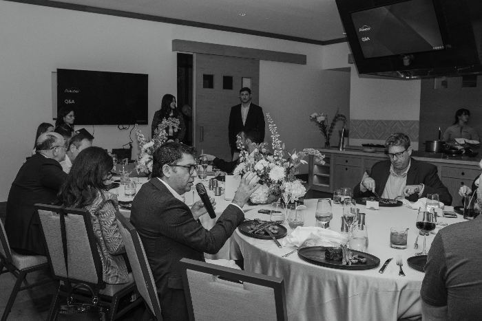 A member speaking into the microphone during the Q and A at the Orlando dinner